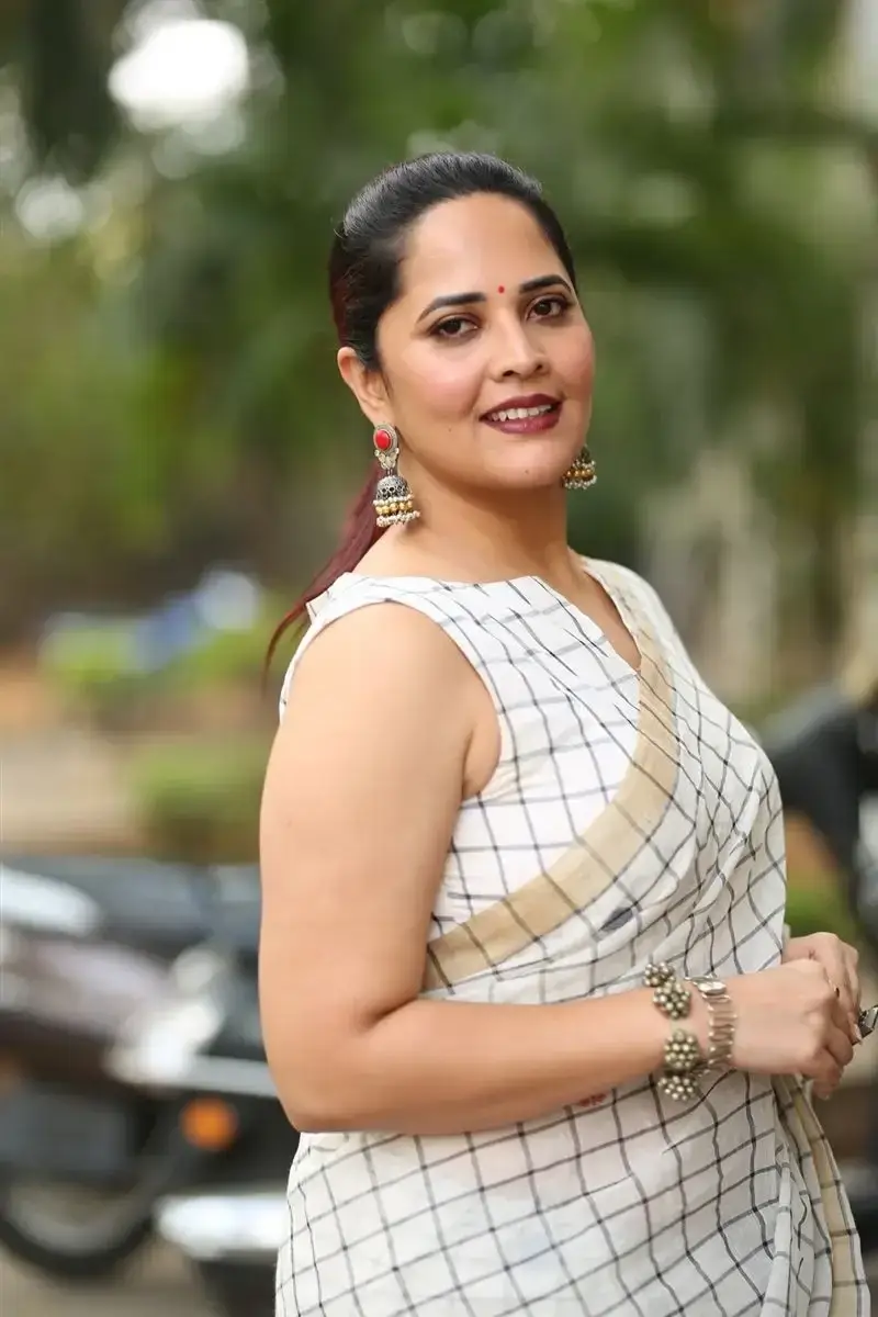 Anasuya Bharadwaj in White Saree at Razakar Movie Launch